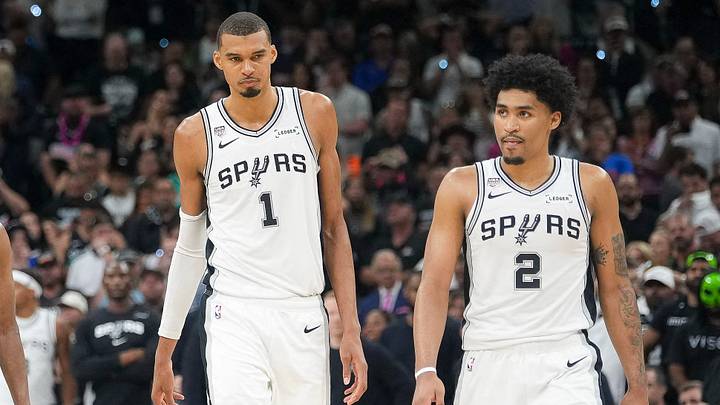 Jun 5, 2026; San Antonio, Texas, USA; San Antonio Spurs guard Devin Vassell (24) and guard Stephon Castle (5) and guard De'aaron Fox (4) and forward Victor Wembanyama (1) and guard Dylan Harper (2) walk back on the court in the fourth quarter during game two of the 2026 NBA Finals at Frost Bank Center. Mandatory Credit: Scott Wachter-Imagn Images