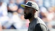 Oct 5, 2024; University Park, Pennsylvania, USA; UCLA Bruins head coach DeShaun Foster walks on the field during a warmup prior to the game against the Penn State Nittany Lions at Beaver Stadium. Mandatory Credit: Matthew O'Haren-Imagn Images