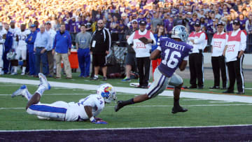 Nov 29, 2014; Manhattan, KS, USA; Kansas State Wildcats wide receiver Tyler Lockett (16) breaks away from a KU player to score a touchdown in the Sunflower Showdown.