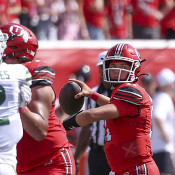 Sep 7, 2024; Salt Lake City, Utah, USA; Utah Utes quarterback Isaac Wilson (11) throws the ball against the Baylor Bears during the second quarter at Rice-Eccles Stadium. Mandatory Credit: Rob Gray-Imagn Images