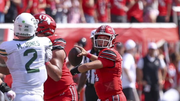 Sep 7, 2024; Salt Lake City, Utah, USA; Utah Utes quarterback Isaac Wilson (11) throws the ball against the Baylor Bears during the second quarter at Rice-Eccles Stadium. Mandatory Credit: Rob Gray-Imagn Images