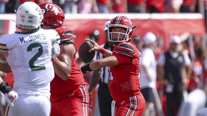 Sep 7, 2024; Salt Lake City, Utah, USA; Utah Utes quarterback Isaac Wilson (11) throws the ball against the Baylor Bears during the second quarter at Rice-Eccles Stadium. Mandatory Credit: Rob Gray-Imagn Images