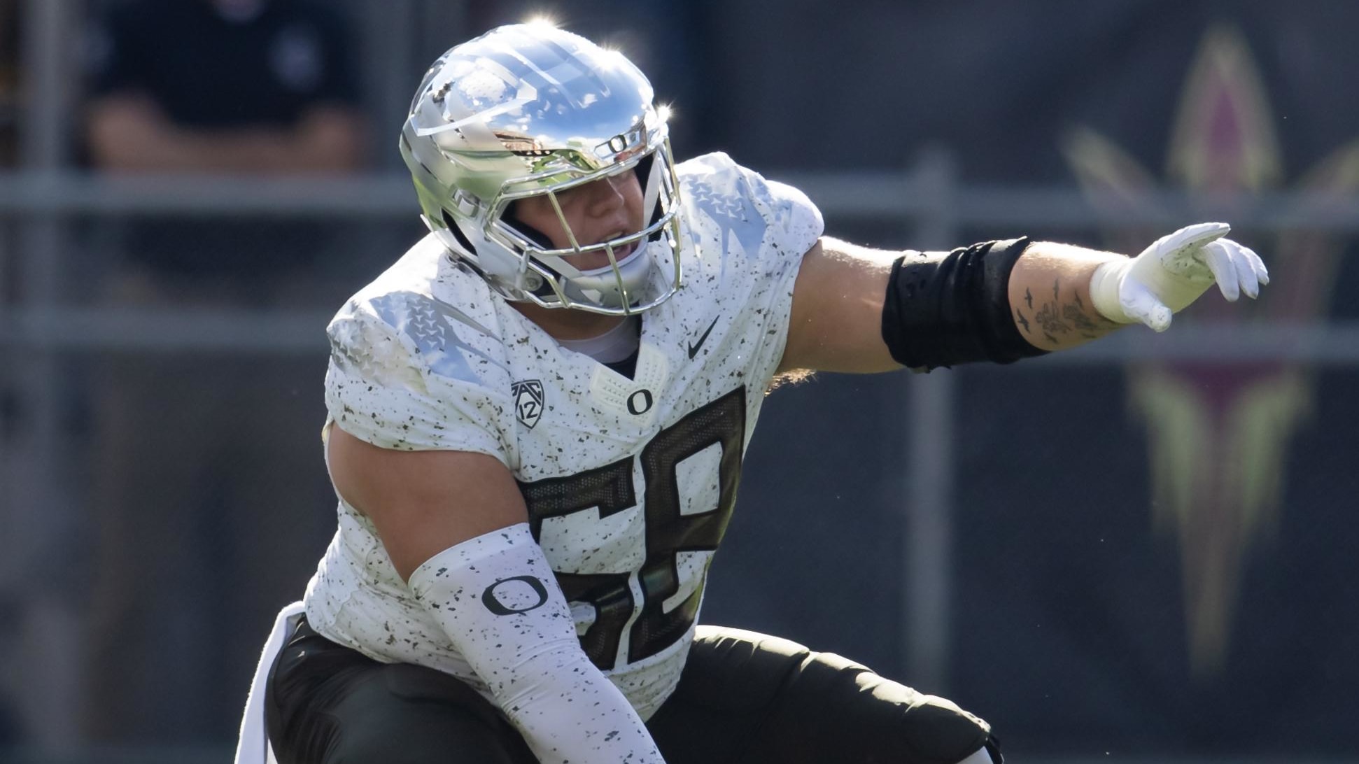 Oregon Ducks offensive lineman Jackson Powers-Johnson prepares to snap the ball.