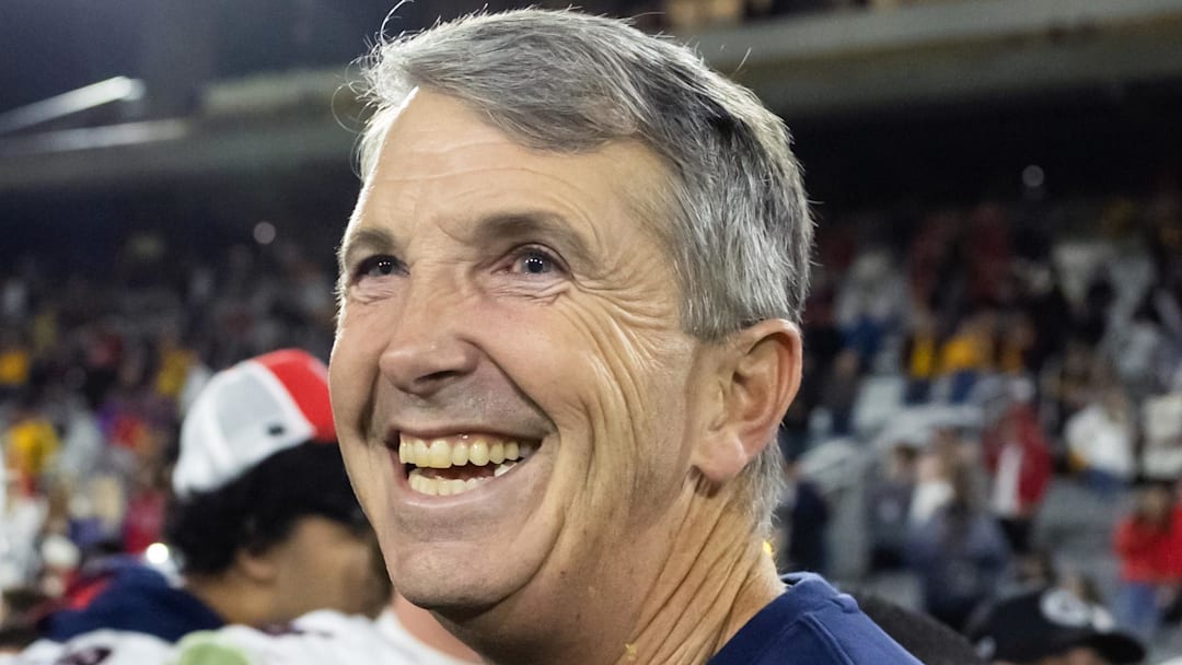 Nov 28, 2025; Tempe, Arizona, USA; Arizona Wildcats head coach Brent Brennan celebrates against the Arizona State Sun Devils during the 99th Territorial Cup at Mountain America Stadium. Mandatory Credit: Mark J. Rebilas-Imagn Images