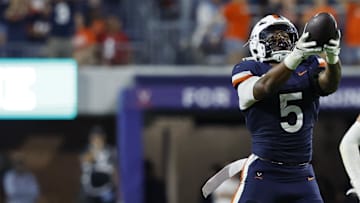 Sep 20, 2025; Charlottesville, Virginia, USA; Virginia Cavaliers linebacker Kam Robinson (5) celebrates after recovering a fumble by Stanford Cardinal quarterback Ben Gulbranson (not pictured) during the fourth quarter at Scott Stadium. Mandatory Credit: Geoff Burke-Imagn Images