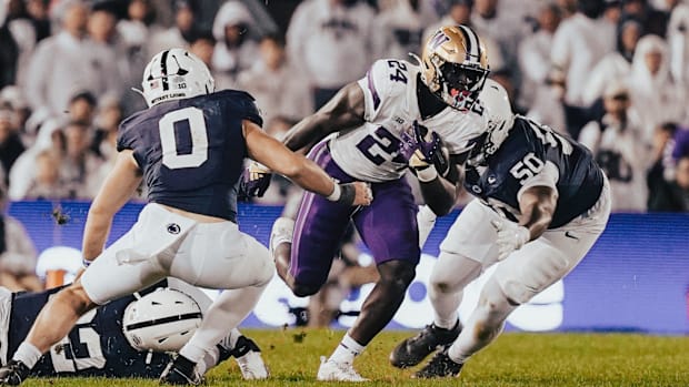 UW freshman Adam Mohammed looks for room to run against Penn State.
