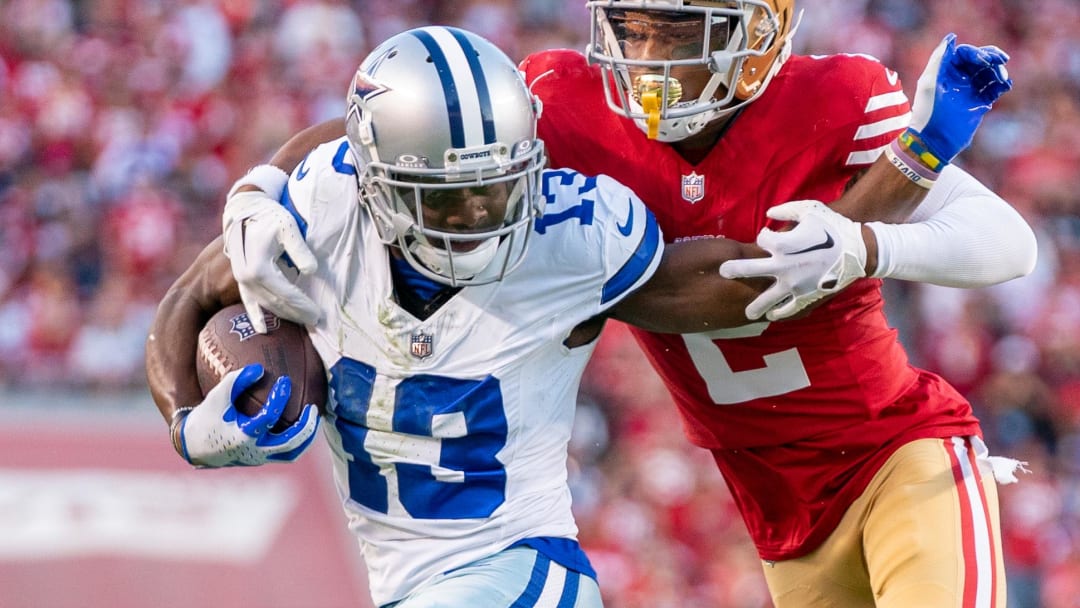 October 8, 2023; Santa Clara, California, USA; San Francisco 49ers cornerback Deommodore Lenoir (2) tackles Dallas Cowboys wide receiver Michael Gallup (13) during the second quarter at Levi's Stadium. Mandatory Credit: Kyle Terada-USA TODAY Sports