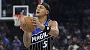 Nov 7, 2025; Orlando, Florida, USA; Orlando Magic forward Paolo Banchero (5) shoots the ball against the Boston Celtics in the third quarter at Kia Center. Mandatory Credit: Nathan Ray Seebeck-Imagn Images