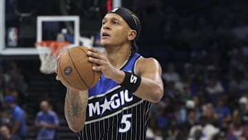 Nov 7, 2025; Orlando, Florida, USA; Orlando Magic forward Paolo Banchero (5) shoots the ball against the Boston Celtics in the third quarter at Kia Center. Mandatory Credit: Nathan Ray Seebeck-Imagn Images