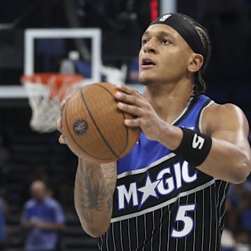 Nov 7, 2025; Orlando, Florida, USA; Orlando Magic forward Paolo Banchero (5) shoots the ball against the Boston Celtics in the third quarter at Kia Center. Mandatory Credit: Nathan Ray Seebeck-Imagn Images