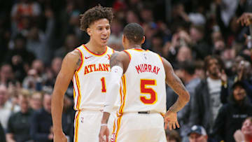 Atlanta Hawks forward Jalen Johnson reacts after a basket with guard Dejounte Murray