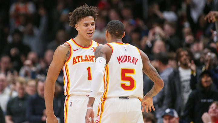 Atlanta Hawks forward Jalen Johnson reacts after a basket with guard Dejounte Murray