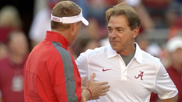 Sep 28, 2013; Tuscaloosa, AL, USA; Alabama Crimson Tide head coach Nick Saban talks with Mississippi Rebels head coach Hugh Freeze midfield before their game against at Bryant-Denny Stadium. Mandatory Credit: John David Mercer-USA TODAY Sports