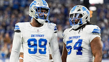 Detroit Lions defensive end Za'Darius Smith (99), left, talks to defensive tackle Alim McNeill (54) at a timeout against Indianapolis Colts during the second half at Lucas Oil Stadium in Indianapolis, Ind. on Sunday, Nov. 24, 2024.