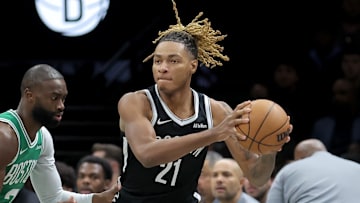 Nov 18, 2025; Brooklyn, New York, USA; Brooklyn Nets forward Noah Clowney (21) looks to pass the ball against Boston Celtics guard Jaylen Brown (7) during the first quarter at Barclays Center. Mandatory Credit: Brad Penner-Imagn Images
