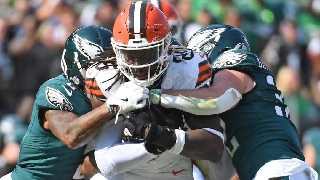 Oct 13, 2024; Philadelphia, Pennsylvania, USA; Cleveland Browns tight end David Njoku (85) is tackled by Philadelphia Eagles cornerback Darius Slay Jr. (2) and safety Reed Blankenship (32) during the second quarter at Lincoln Financial Field.