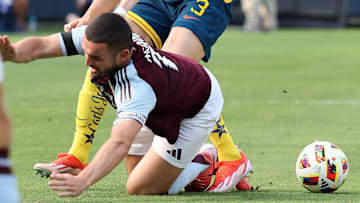 Aug 3, 2024; Chicago, Illinois, USA; Club America defender Israel Reyes (3) slide tackles Aston Villa midfielder John McGinn (7) during the first half at Soldier Field. Mandatory Credit: Mike Dinovo-Imagn Images