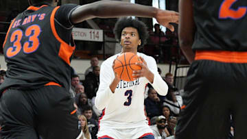 Stepinac’s Adonis Ratliff (3) puts up a shot against Saint Raymonds during the CHSAA AA city championship game at Fordham University in the Bronx March 9, 2025. Stepinac won the game in overtime 63-61.