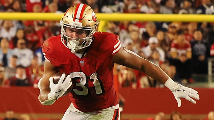 Oct 27, 2024; Santa Clara, California, USA; San Francisco 49ers running back Isaac Guerendo (31) carries the ball against the Dallas Cowboys during the third quarter at Levi's Stadium. Mandatory Credit: Kelley L Cox-Imagn Images Oct 27, 2024; Santa Clara, California, USA; San Francisco 49ers running back Isaac Guerendo (31) carries the ball against the Dallas Cowboys during the third quarter at Levi's Stadium. Mandatory Credit: Kelley L Cox-Imagn Images