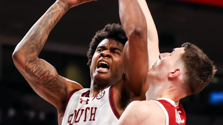 South Carolina Gamecocks forward Nick Pringle (5) scores while being fouled by Arkansas Razorbacks forward Zvonimir Ivisic (44) in the first half at Colonial Life Arena. 