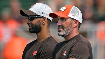 Browns GM Andrew Berry, left, and coach Kevin Stefanski watch practice in training camp, Saturday, July 31, 2021, in Berea.