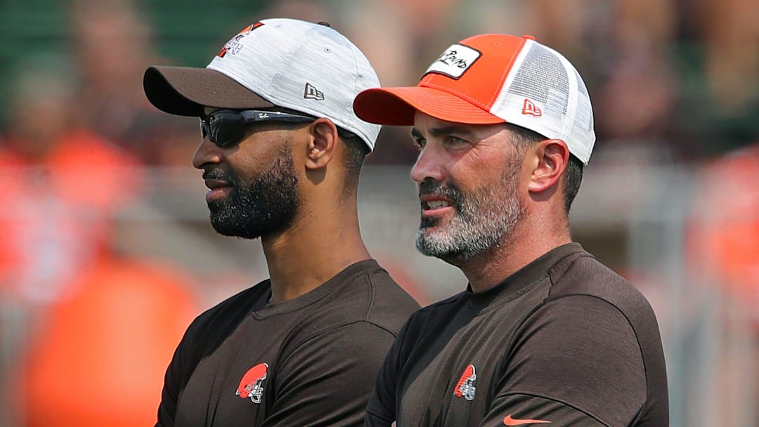 Browns GM Andrew Berry, left, and coach Kevin Stefanski watch practice in training camp, Saturday, July 31, 2021, in Berea.