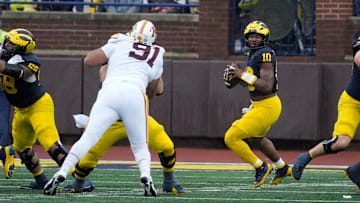 Michigan quarterback Alex Orji looks to throw downfield during first-half action between Michigan and Minnesota at Michigan Stadium in Ann Arbor on Saturday, Sept. 28, 2024.