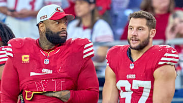 San Francisco 49ers left tackle Trent Williams (L) and defensive end Nick Bosa (R)