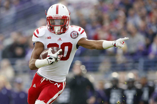 Nebraska Cornhuskers wide receiver Kenny Bell gestures as he catches the ball and runs it in for a touchdown.