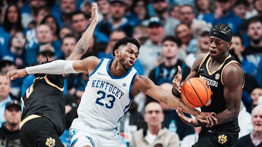 Kentucky forward Mo Dioubate gets double-teamed by Missouri guard Anthony Robinson II and forward Mark Mitchell.