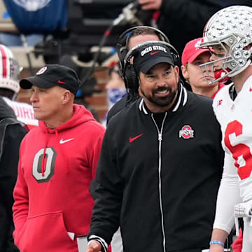 Nov 25, 2023; Ann Arbor, Michigan, USA; Ohio State Buckeyes head coach Ryan Day talks to quarterback Kyle McCord (6) on the sideline during the second half of the NCAA football game against the Michigan Wolverines at Michigan Stadium. Ohio State lost 30-24.