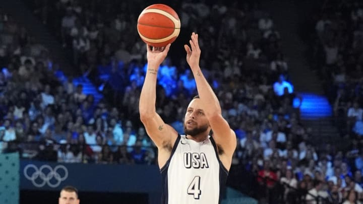 Aug 8, 2024; Paris, France; United States shooting guard Stephen Curry (4) shoots the ball during the first half against Serbia in a men's basketball semifinal game during the Paris 2024 Olympic Summer Games at Accor Arena. Mandatory Credit: Rob Schumacher-USA TODAY Sports