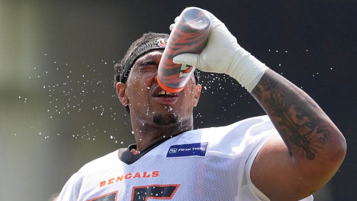 Jul 26, 2024; Cincinnati, OH, USA; Cincinnati Bengals offensive tackle Orlando Brown Jr. (75) cools off with water during training camp practice at Kettering Health Practice Fields. Mandatory Credit: Kareem Elgazzar-USA TODAY Sports