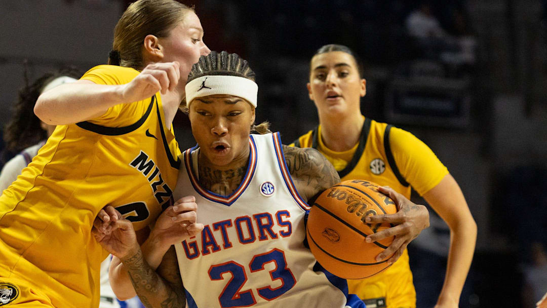Florida guard Liv McGill (23) drives past Missouri guard Grace Slaughter (0) during the first half of an NCAA Women’s basketball game at Exactech Arena in the Steven C. O'Connell Center in Gainesville, FL on Sunday, January 18, 2026. [Alan Youngblood/Gainesville Sun]