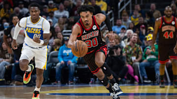 Nov 29, 2025; Indianapolis, Indiana, USA; Chicago Bulls guard Tre Jones (30) brings the ball up court against Indiana Pacers guard Bennedict Mathurin (00) during the first half at Gainbridge Fieldhouse. Mandatory Credit: Trevor Ruszkowski-Imagn Images