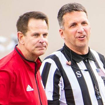 Indiana Head Coach Curt Cignetti talks with an referee before the start of the Indiana versus Western Illinois football game at Memorial Stadium on Friday, Sept. 6, 2024.