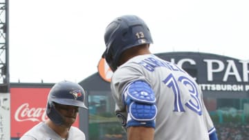 Sep 4, 2022; Pittsburgh, Pennsylvania, USA;  Toronto Blue Jays second baseman Cavan Biggio (left) is