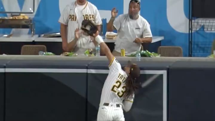 San Diego Padres right fielder Fernando Tatis Jr. robs a home run from New York Mets designated hitter Mark Vientos.