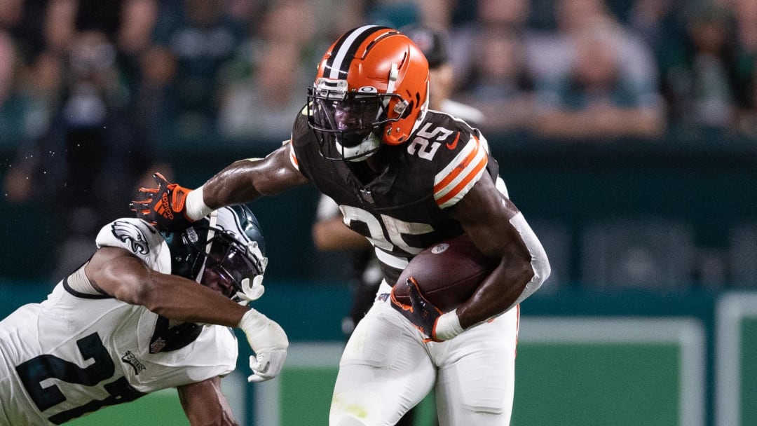 Aug 17, 2023; Philadelphia, Pennsylvania, USA; Cleveland Browns running back Demetric Felton Jr. (25) breaks the tackle attempt of Philadelphia Eagles cornerback Zech McPhearson (27) during the second quarter at Lincoln Financial Field. Mandatory Credit: Bill Streicher-USA TODAY Sports