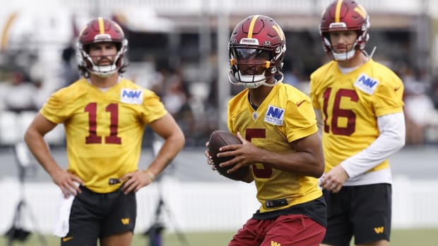 Washington Commanders quarterbacks Jayden Daniels, Sam Hartman, and Jeff Driskel.