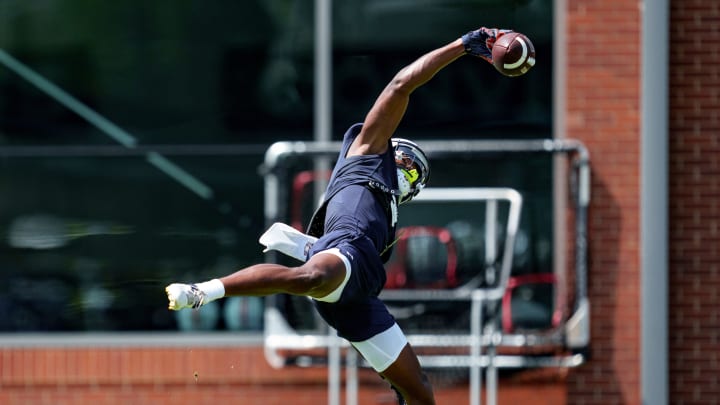 Auburn Tigers Wide Receiver Cam Coleman makes a one-handed catch during a fall camp practice.