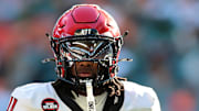 Nov 15, 2025; Miami Gardens, Florida, USA; NC State Wolfpack quarterback CJ Bailey (11) looks on against the Miami Hurricanes during the first quarter at Hard Rock Stadium. Mandatory Credit: Sam Navarro-Imagn Images