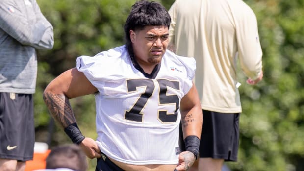 New Orleans Saints offensive tackle Taliese Fuaga (75) looks on during rookie minicamp