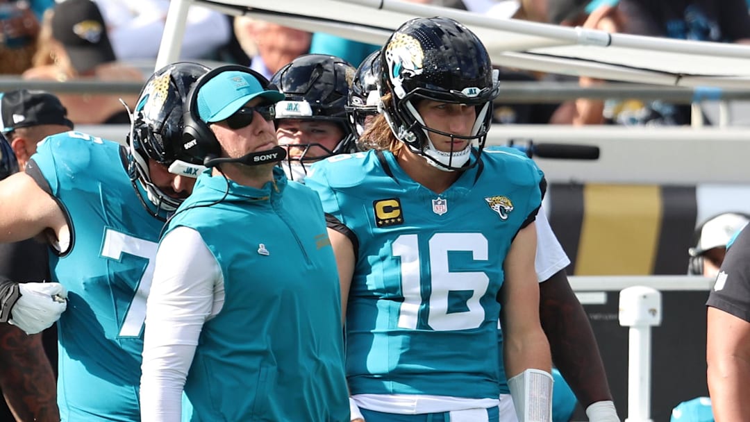 Dec 14, 2025; Jacksonville, Florida, USA; Jacksonville Jaguars head coach Liam Coen stands with quarterback Trevor Lawrence (16) during the second quarter against the New York Jets at EverBank Stadium. Mandatory Credit: Morgan Tencza-Imagn Images
