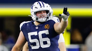 Nov 28, 2024; Arlington, Texas, USA; Dallas Cowboys center Cooper Beebe (56) signals at the line against the New York Giants during the second quarter at AT&T Stadium.