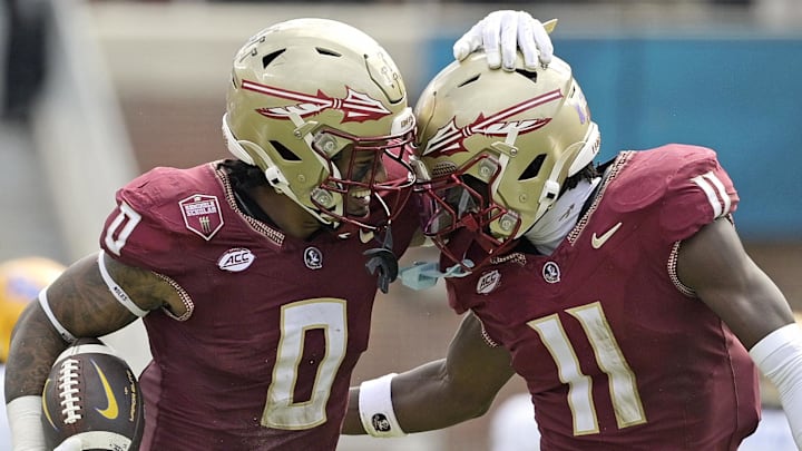 Oct 11, 2025; Tallahassee, Florida, USA; Florida State Seminoles safety Earl Little Jr. (0) and defensive back Ja'Bril Rawls (11) celebrate after an interception during the first half of the game against the Pittsburgh Panthers at Doak S. Campbell Stadium. Mandatory Credit: Melina Myers-Imagn Images