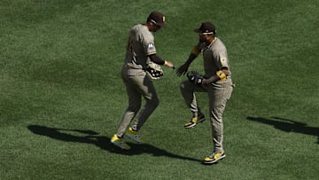 San Diego Padres outfielder Tyler Wade (14) celebrates with Padres first baseman Luis Arraez (4) after their game against the Washington Nationals at Nationals Park on July 20.