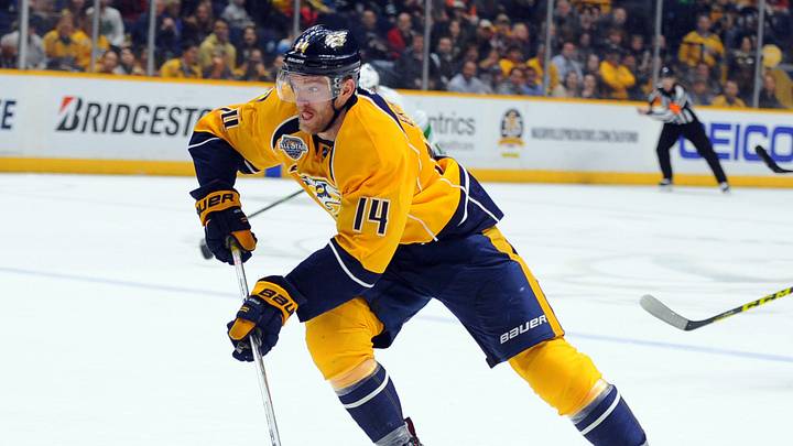 Mar 24, 2016; Nashville, TN, USA; Nashville Predators defenseman Mattias Ekholm (14) skates the puck into the offensive zone during the third period against the Vancouver Canucks at Bridgestone Arena. Mandatory Credit: Christopher Hanewinckel-USA TODAY Sports Mar 24, 2016; Nashville, TN, USA; Nashville Predators defenseman Mattias Ekholm (14) skates the puck into the offensive zone during the third period against the Vancouver Canucks at Bridgestone Arena. Mandatory Credit: Christopher Hanewinckel-USA TODAY Sports