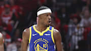 Apr 20, 2025; Houston, Texas, USA; Houston Rockets forward Amen Thompson (1) and Golden State Warriors forward Jimmy Butler III (10) react after Butler scores a basket during the third quarter at Toyota Center. Mandatory Credit: Troy Taormina-Imagn Images