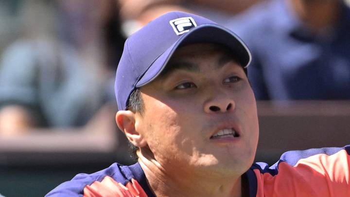 Brandon Nakashima stretches for a shot